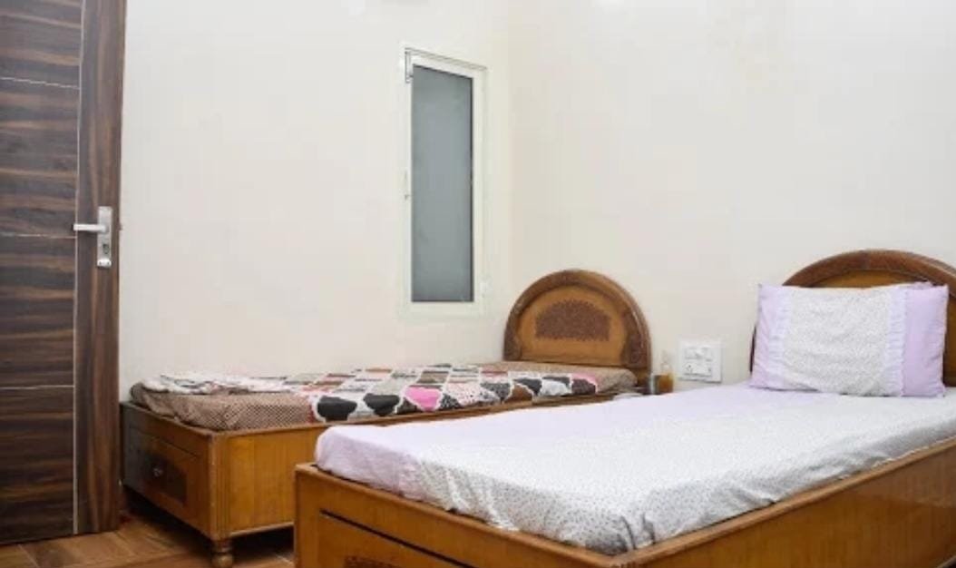 Home Away Home Real Double Sharing AC Room with Wooden Beds